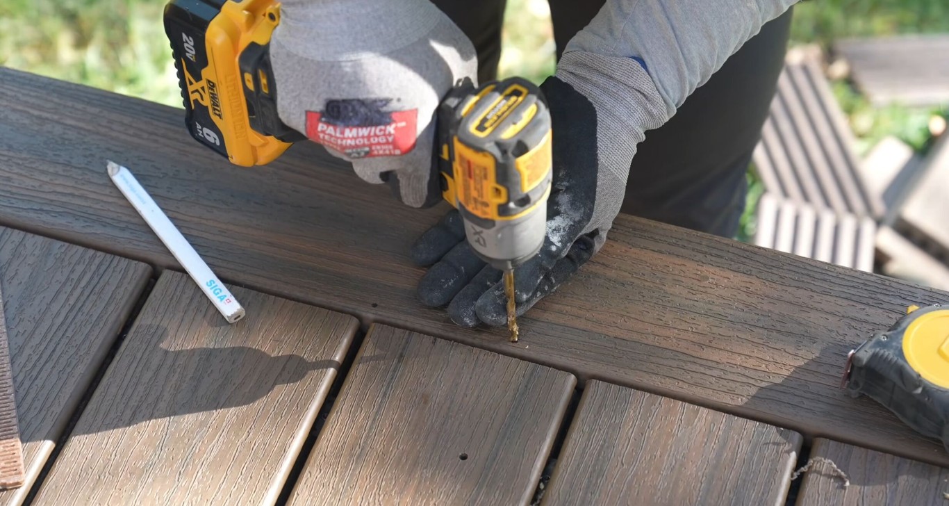 Skilled deck builder installing composite decking in Queen Creek